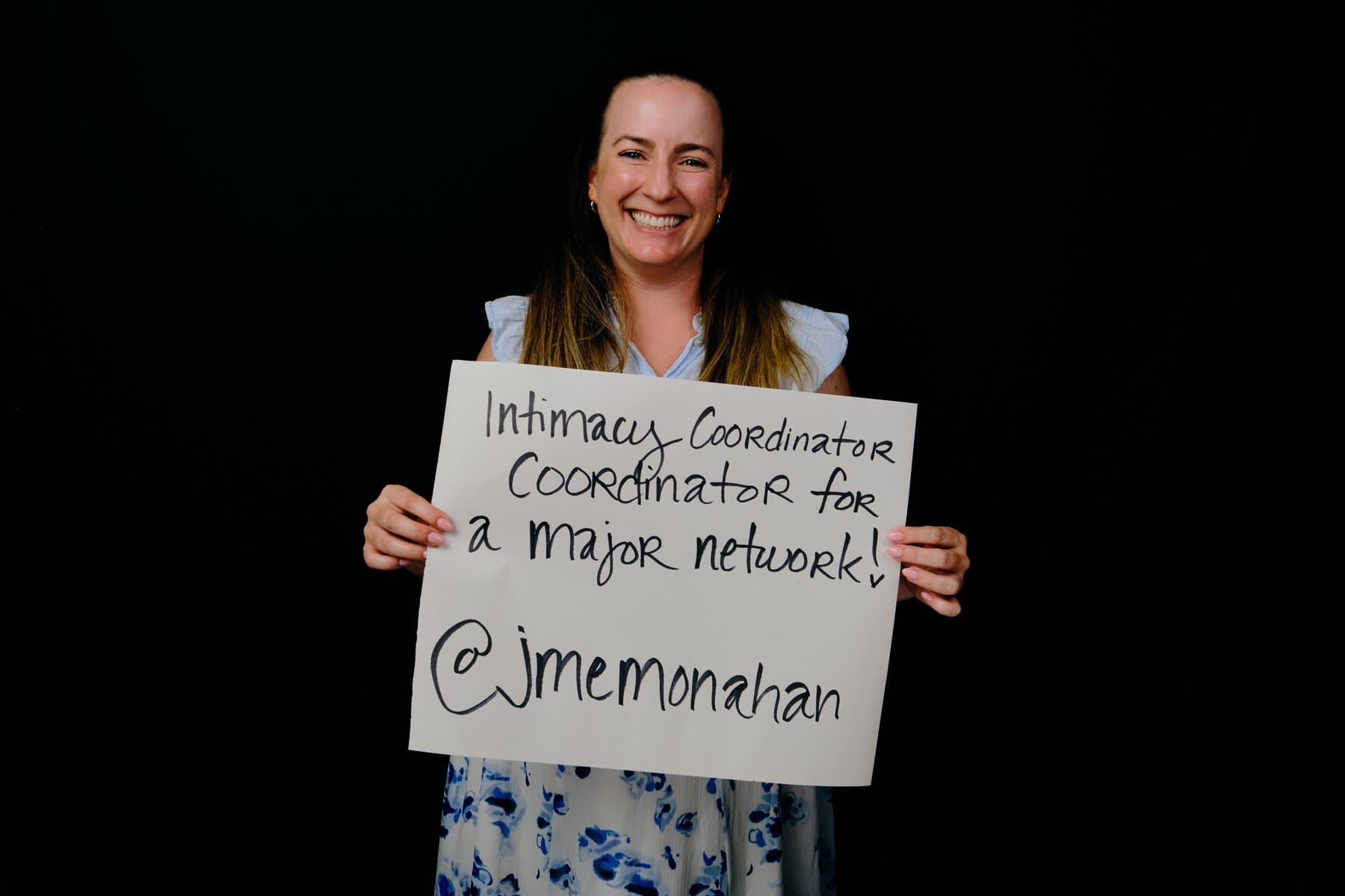 Dreams & Obstacles, August 10 — a dreamer holding their sign