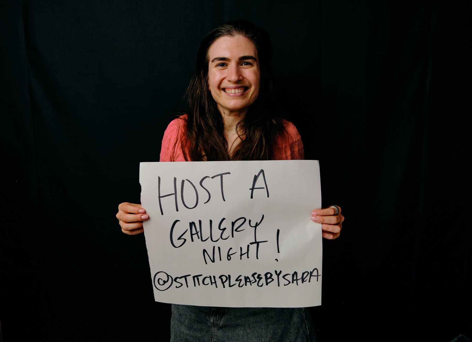 Dreams & Obstacles, August 10 — a dreamer holding their sign