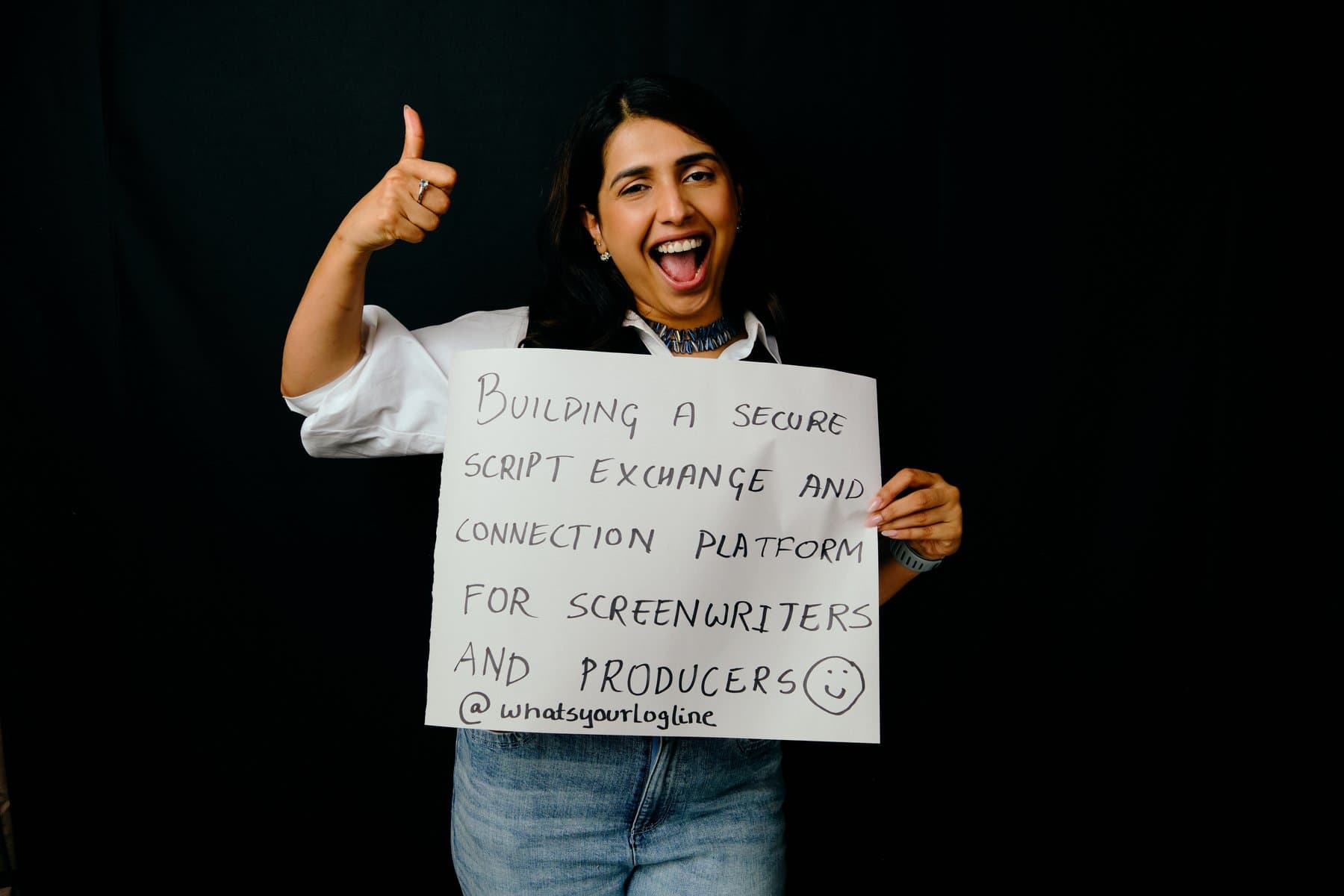 Dreams & Obstacles, August 10 — a dreamer holding their sign
