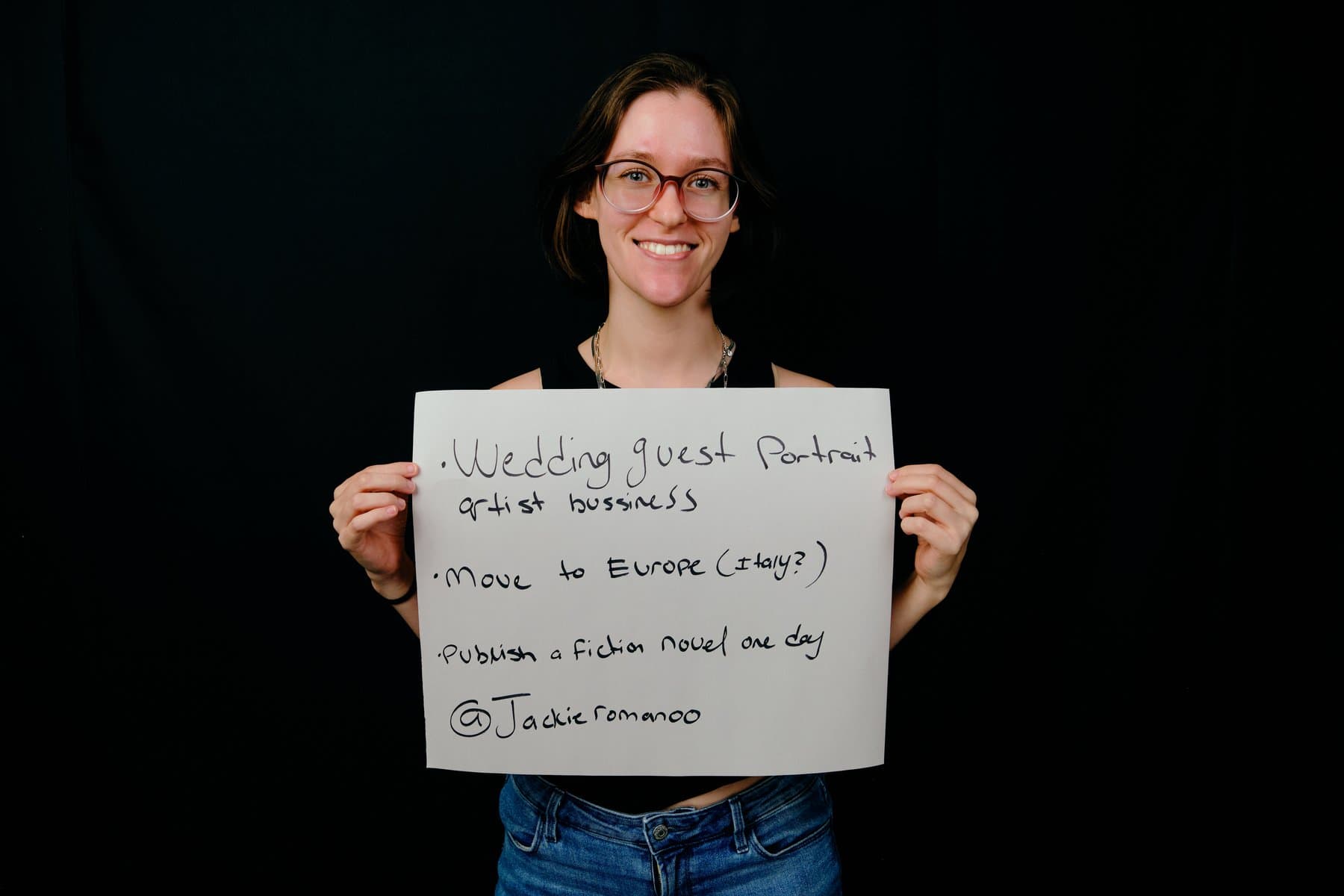 Dreams & Obstacles, August 10 — a dreamer holding their sign