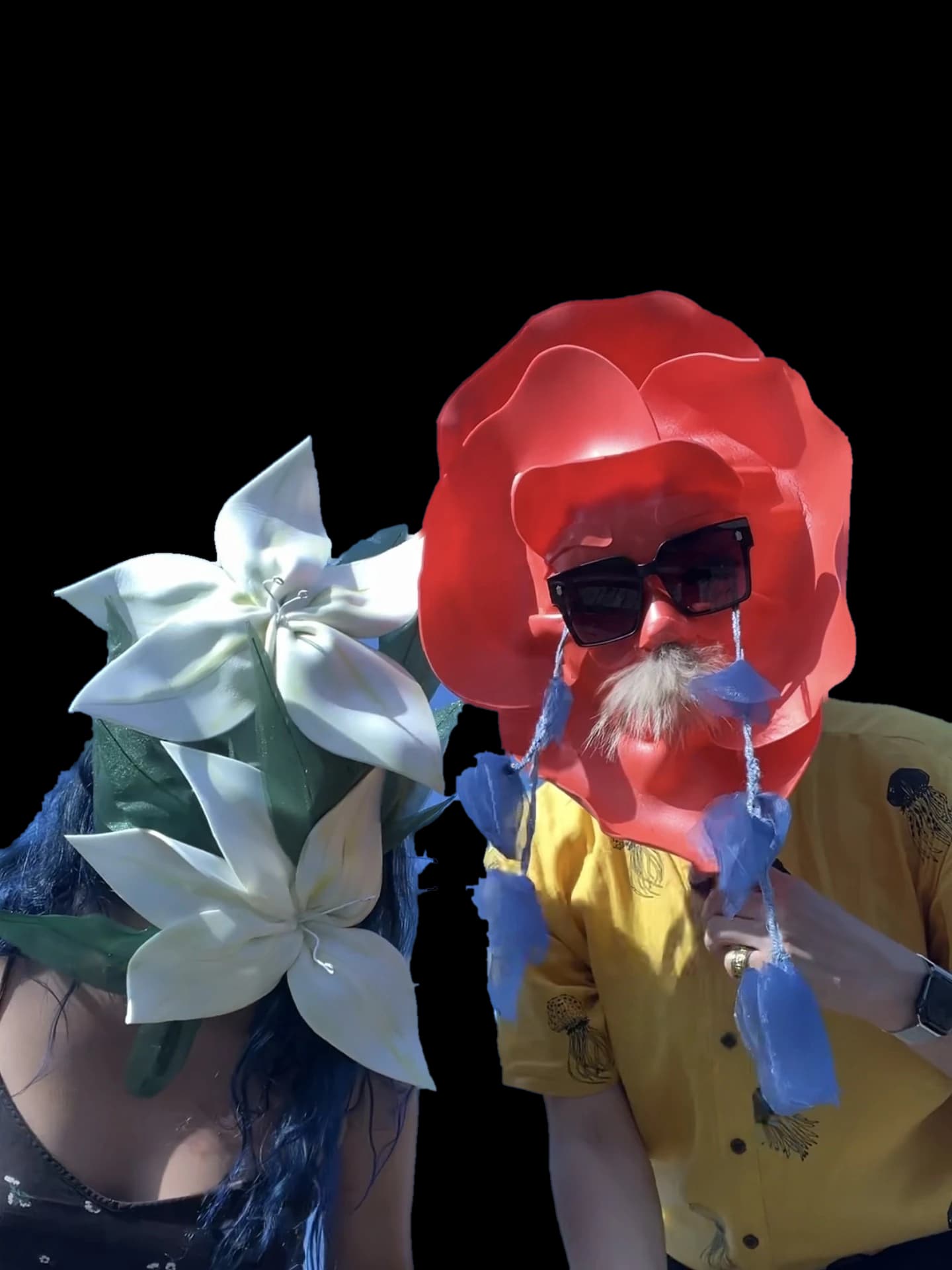 Two guests in giant flower masks at Beyond the Looks, Fruit & Flowers' speed dating in masks