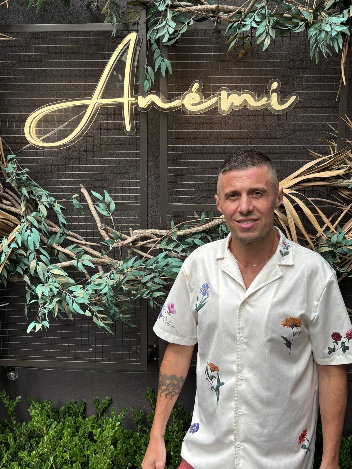 George Kalosis under the Anémi sign in Astoria