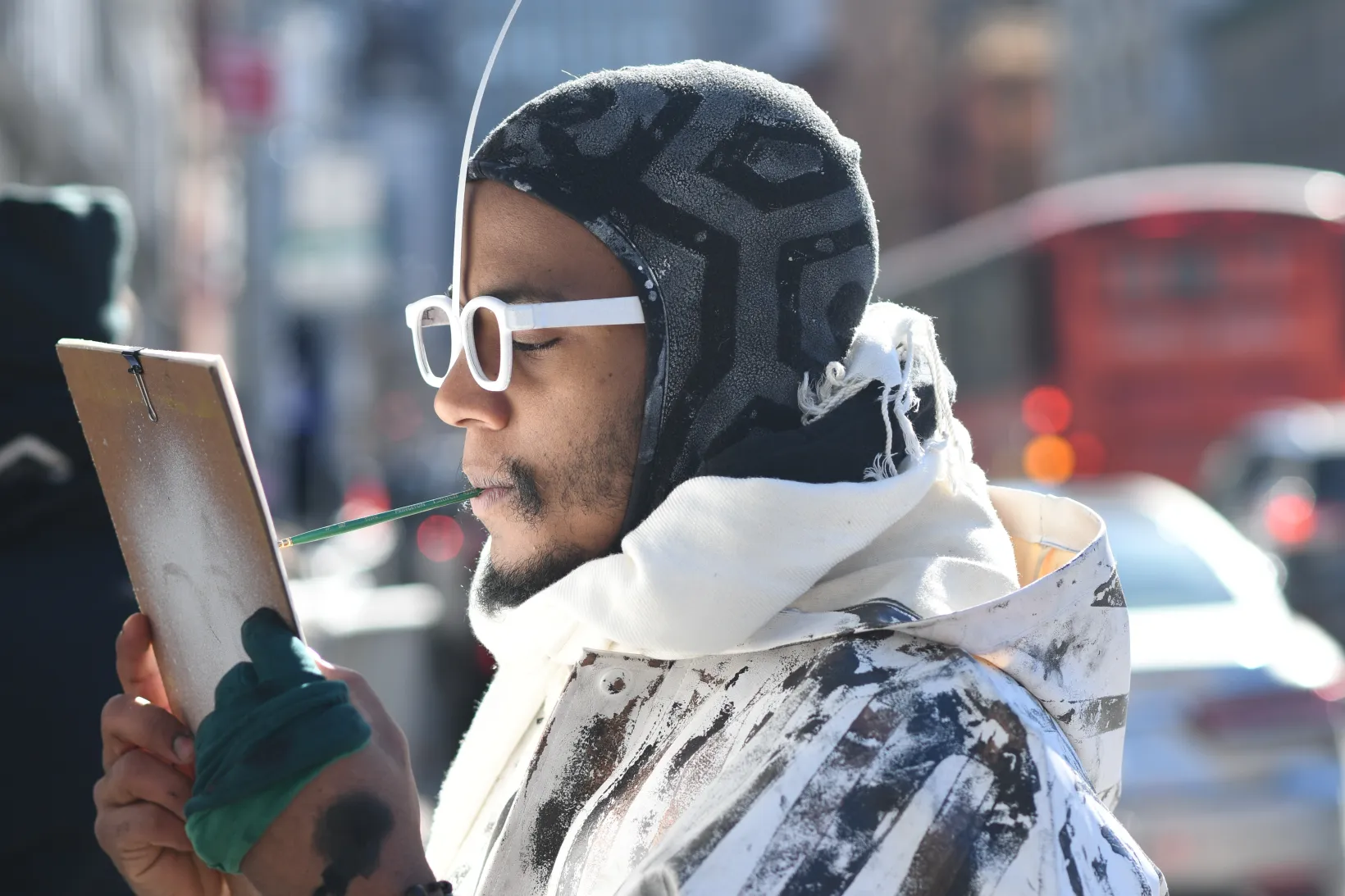 Dig Ferreira outside in New York City drawing