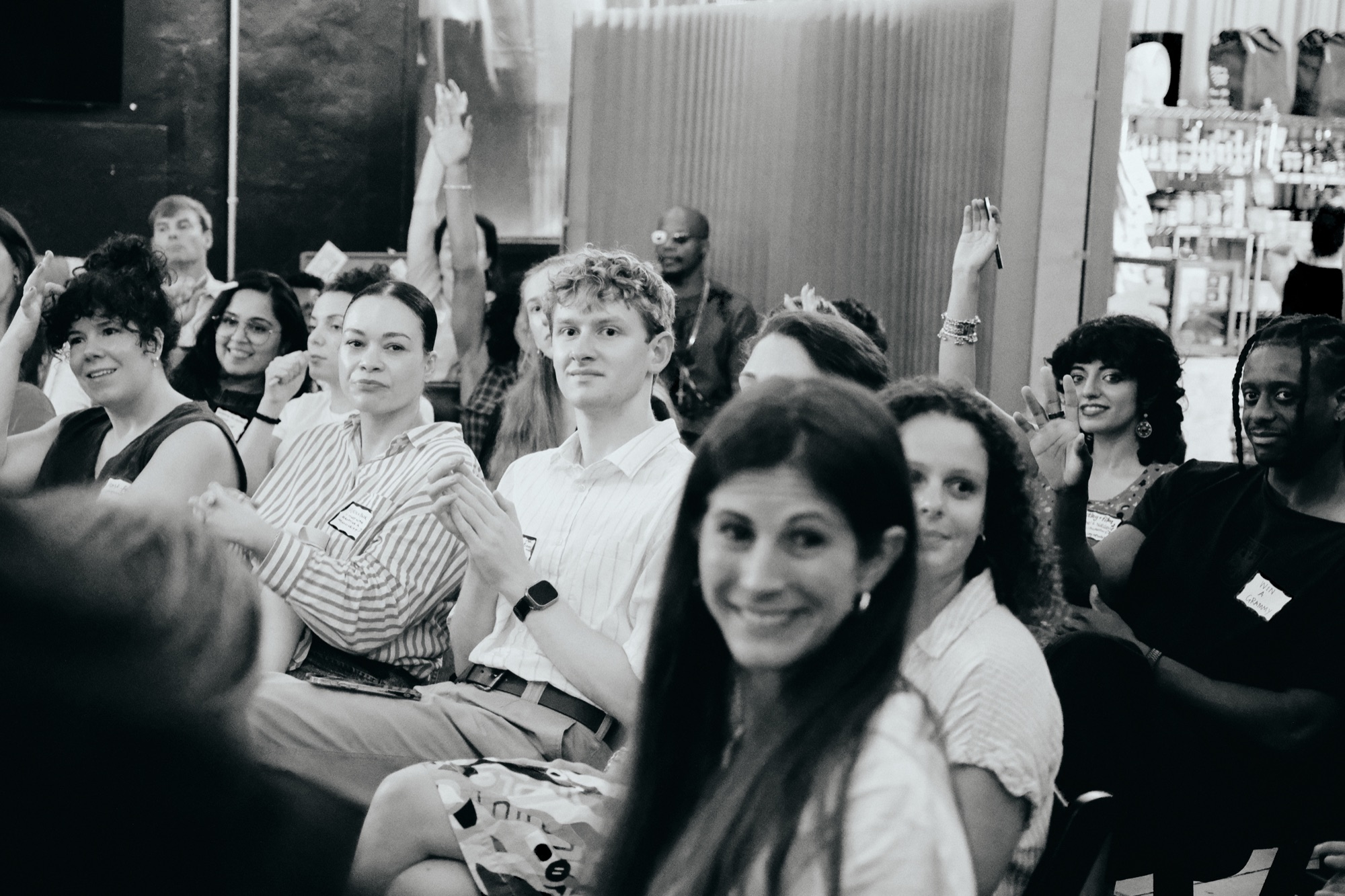 The room at Farm.One listening, seated close together